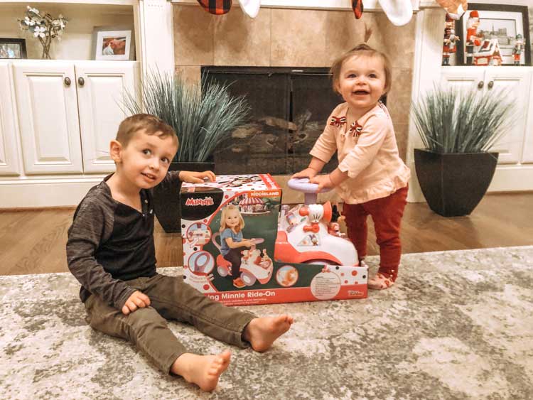 brother and sister playing with toys